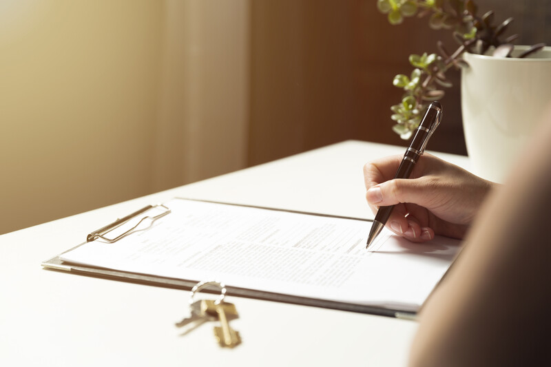 A customer signing a buy-to-let contract