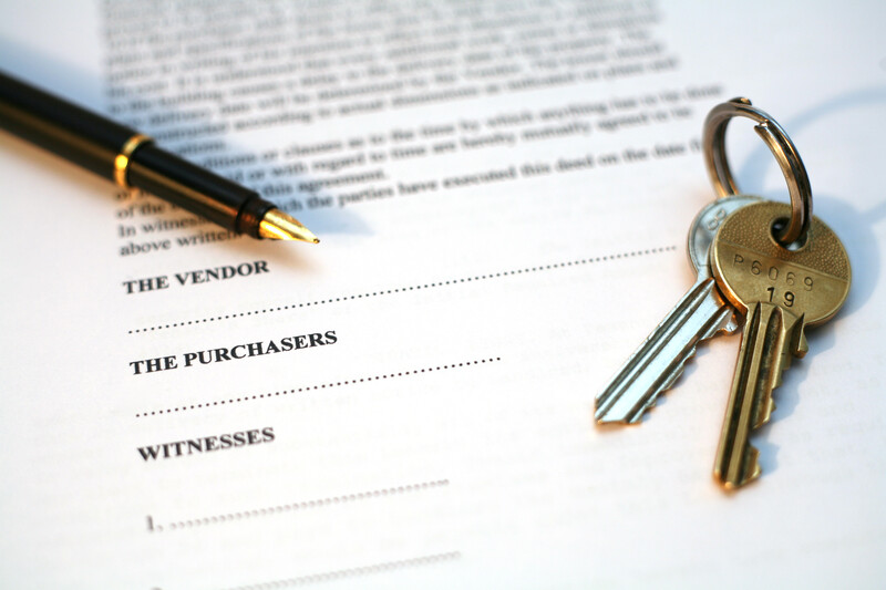 Some conveyancing papers, a pen, and a key