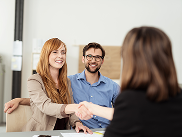 Two women shaking hands